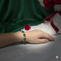 Hand wearing a green beaded bracelet