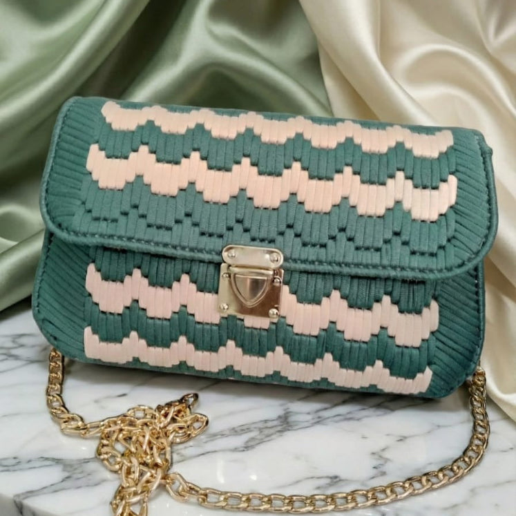 Green and pink woven handbag with gold chain