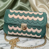 Green and pink woven handbag with gold chain