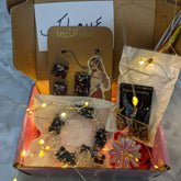 Box with jewelry and decorative lights on a reflective surface