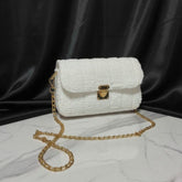 White textured handbag with gold chain strap