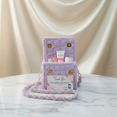 Purple textured handbag with a chain strap
