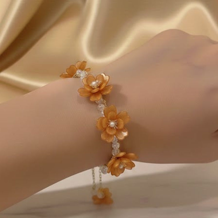 Bracelet with orange floral design
