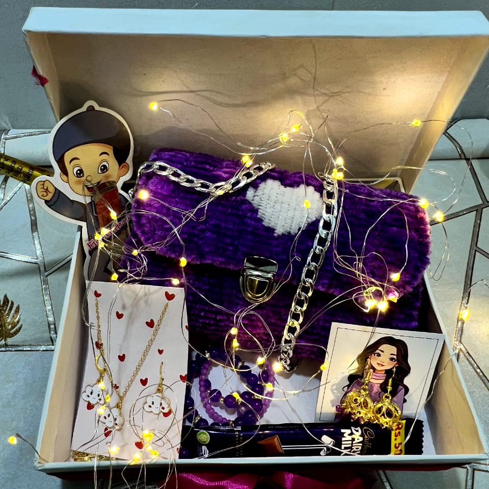 Decorative box with a purple bag, string lights, and cartoon character cutout.