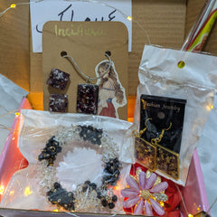 Jewelry set with necklaces and earrings in a box, featuring InciArt packaging.