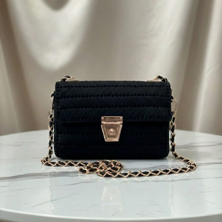 Black handbag with gold chain 