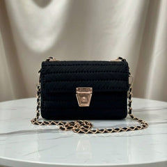 Black handbag with gold chain 