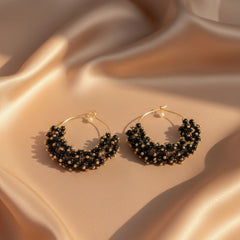 Pair of black beaded hoop earrings 