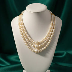 Pearl necklace on a mannequin bust 