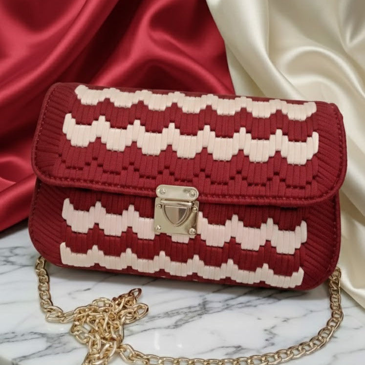 Red and white patterned handbag with gold chain 