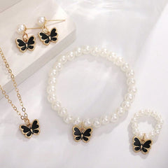 Jewelry set with butterfly charms on a white background